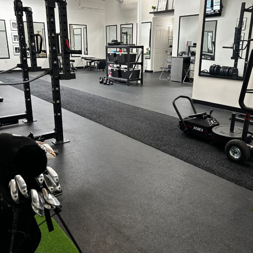 a gym with a cart and equipment in it.