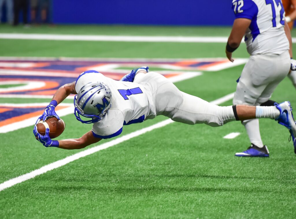 Football Player Diving for endzone - Scottsdale Physical Therapy & Performance - Scottsdale Physical Therapy & Performance Proprioceptive Training