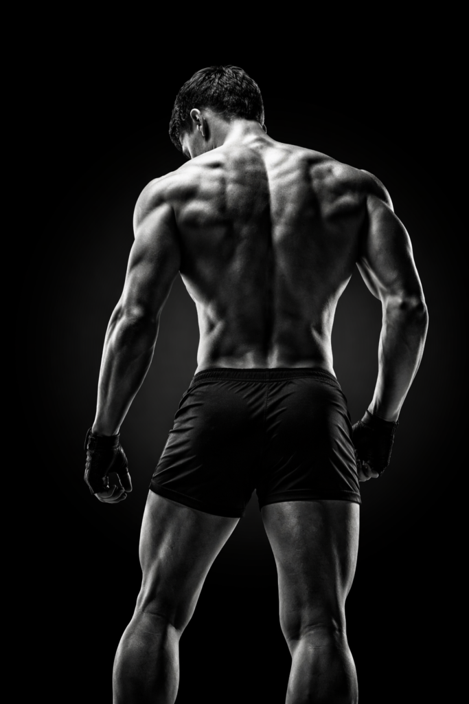 Male athlete showing back muscle engagement during Scottsdale neuromuscular activation training for strength and performance improvement