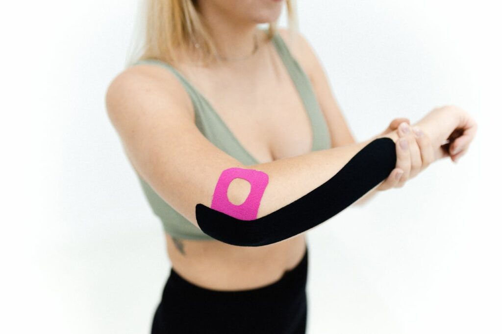 Pain where elbow bends shown at the elbow crease with a support sleeve during a stretch.
