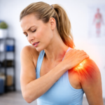 Woman experiencing shoulder pain and burning with visible inflammation in the shoulder joint