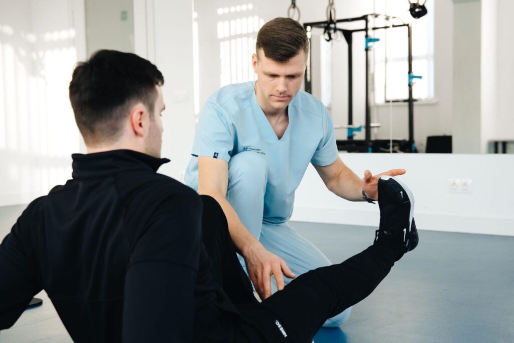 Sports physical therapist performing leg assessment on active adult patient in Scottsdale